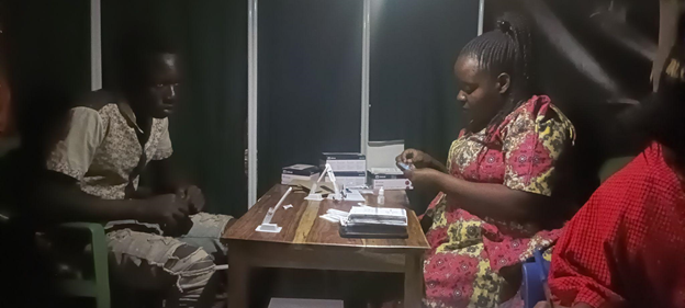 HCPs and ABYM client during moonlight mobile testing at Ushetu and Ulowa ward