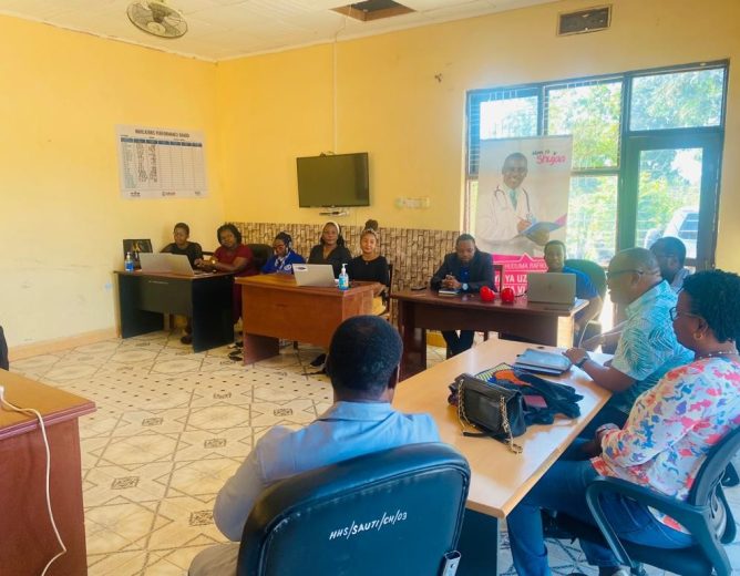 HUHESO staff with capacity development team from fhi360